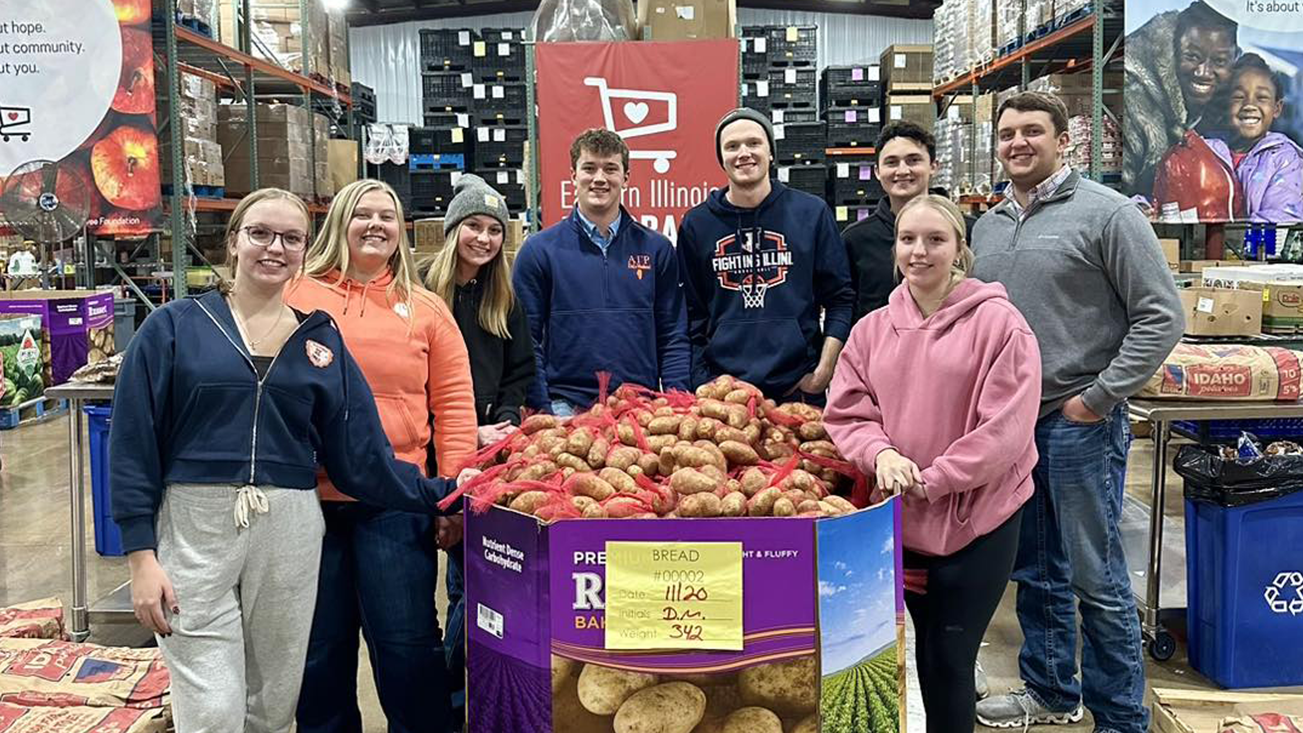 Group of people volunteering at a Harvest for All event. 