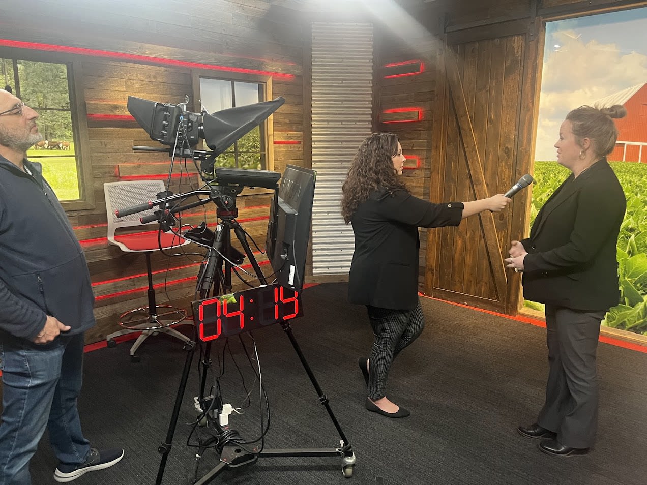Woman being interviewed in a studio.