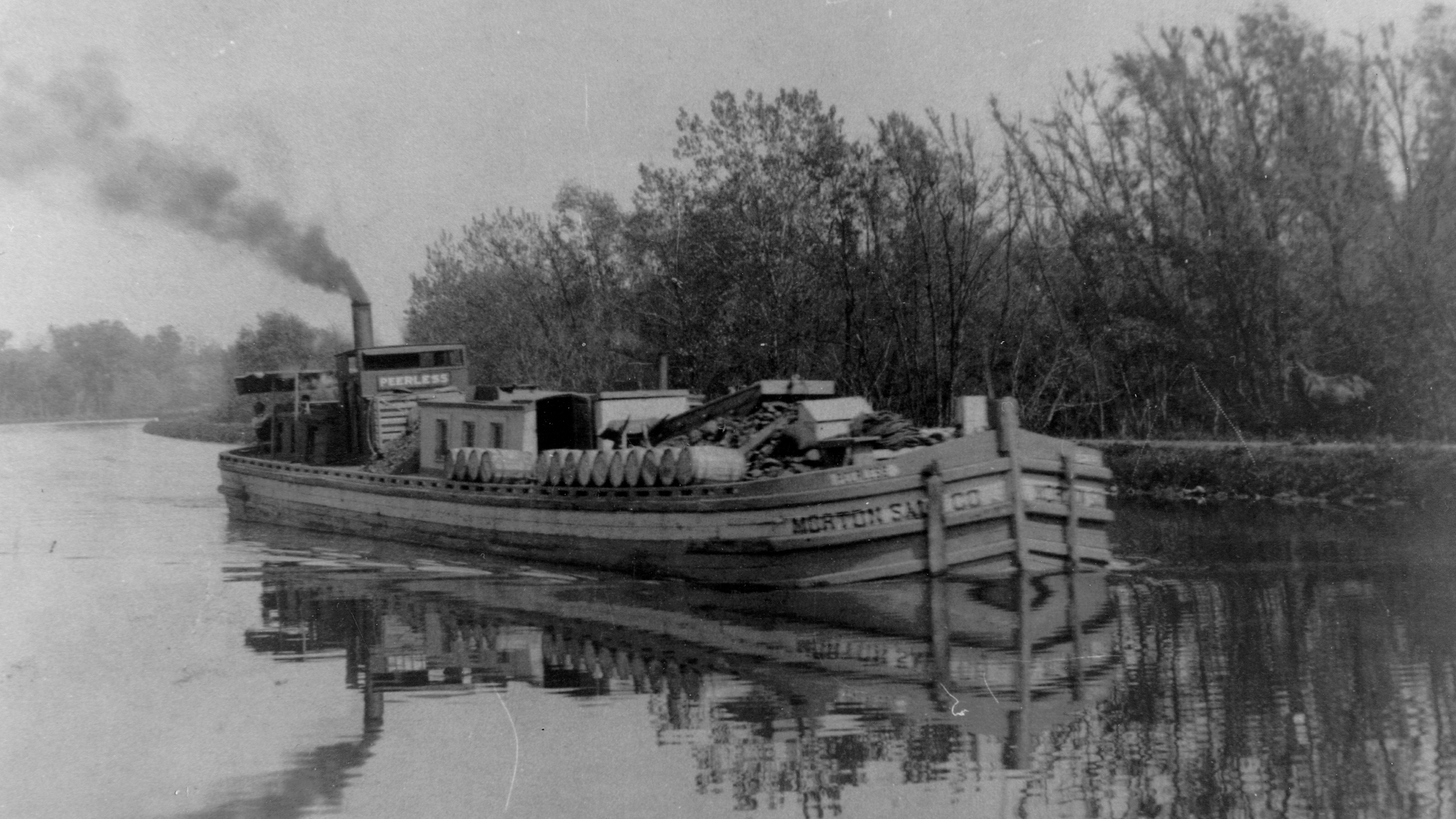 Old black and white photo of the Morton Salt Co. boat floating on the I&M Canal.