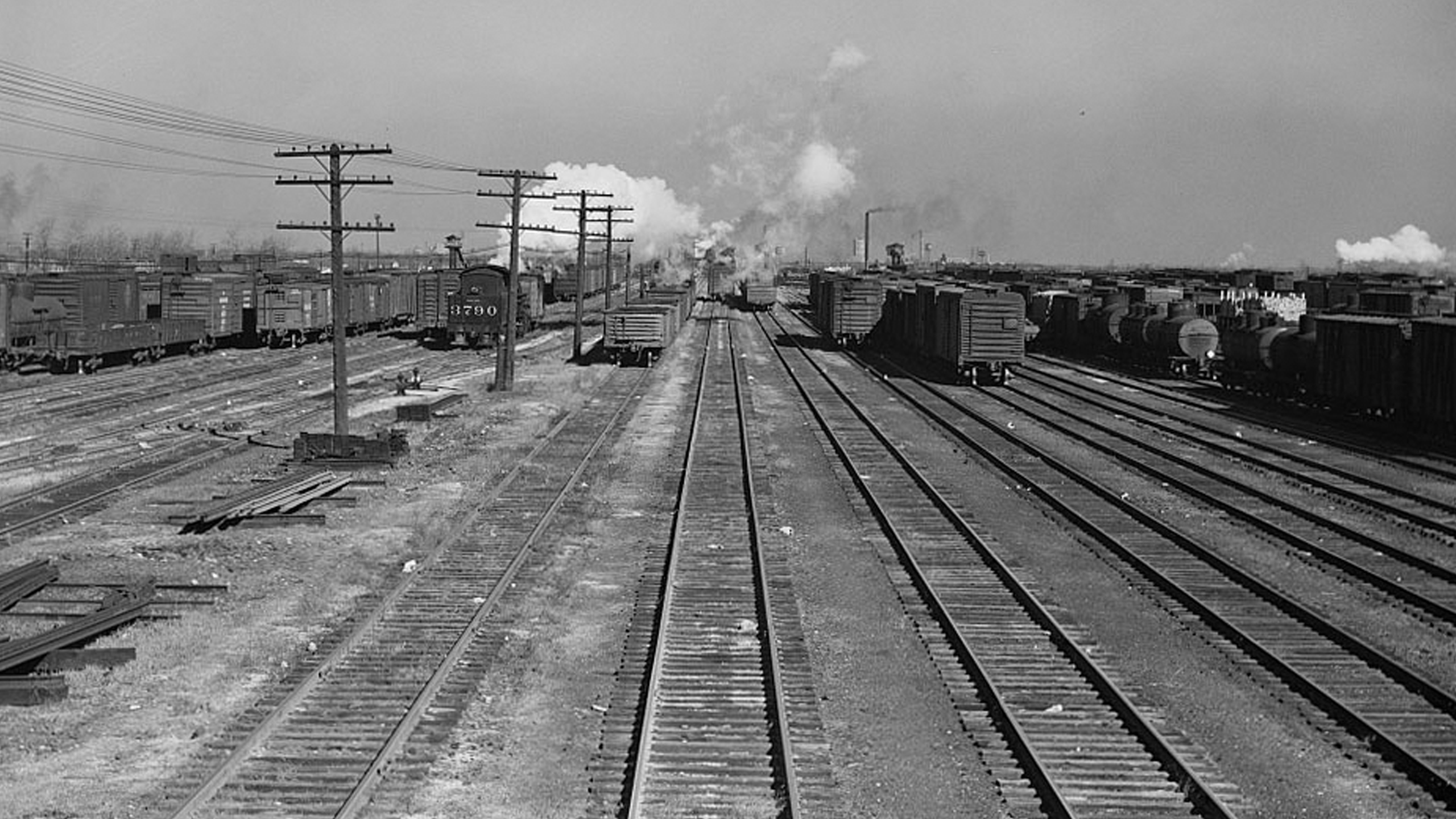 Old time black and white image of train tracks.